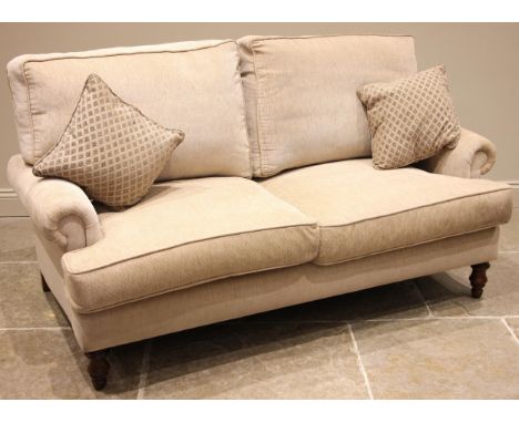 A Nova bespoke 'George' two seater sofa, early 21st century, upholstered in oatmeal coloured fabric, the padded scrolled arms