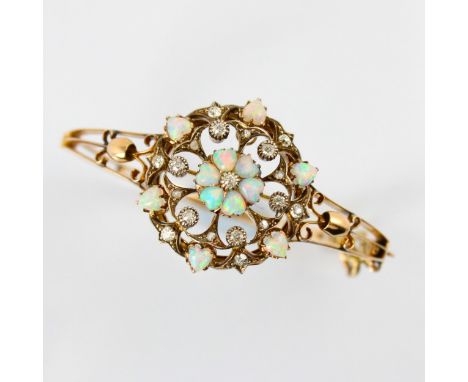 A late 19th century diamond and opal pendant (converting to a bangle) the central six heart shaped opal cabochons designed as