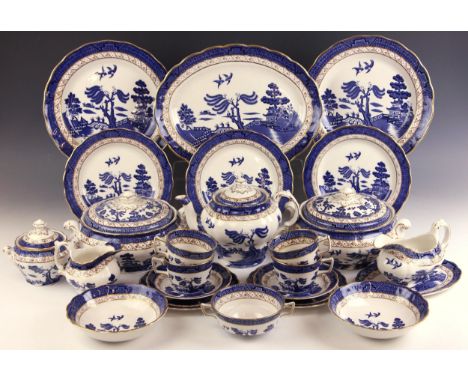 A Royal Doulton ‘The Majestic Collection’ part dinner service in the ‘Booths Real Old Willow’ pattern, comprising: six twin h