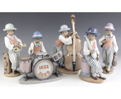 A Lladro five piece jazz band, comprising: a model 05928 Jazz Clarinet, a model 05929 Jazz Drums, a model 05832 Jazz Horn, a 