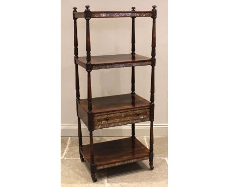 A William IV rosewood and mother of pearl inlaid four tier what not reading stand, the adjustable upper tier enclosed by carv