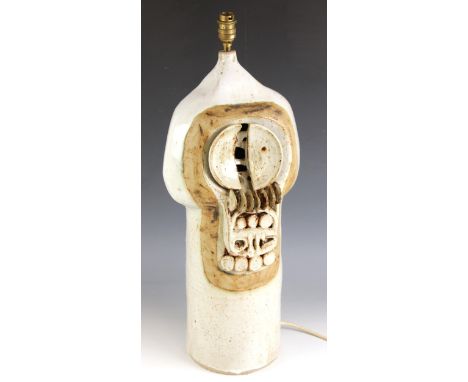 A Cornish style studio pottery lamp base in the manner of Troika, mid 20th century, the cylindrical and bulbous body of large