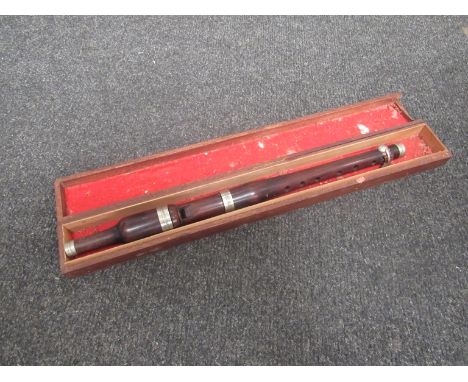 A rosewood recorder in wooden box