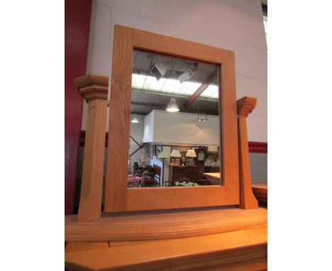 A light oak dressing table mirror