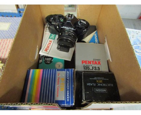 A Pentax MV-1 SLR camera with various lenses, power winder and flash