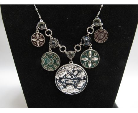 A multi pendant necklace with faux enamel designs       