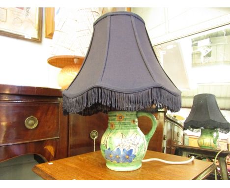 A Flaxman ware Wadeheath jug adapted to a table lamp with navy shade