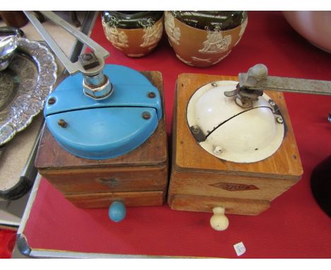Two vintage coffee grinders, Peugeot and Cyrus 