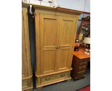 A light oak wardrobe, two doors and single base drawer, 190cm high x 107cm wide