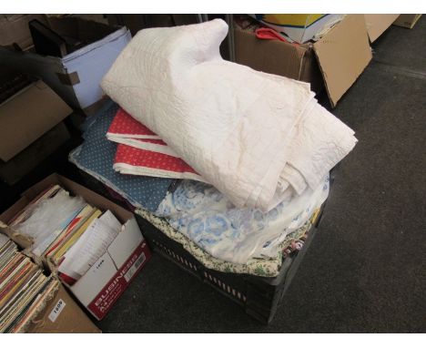 A box of mixed vintage fabric remnants