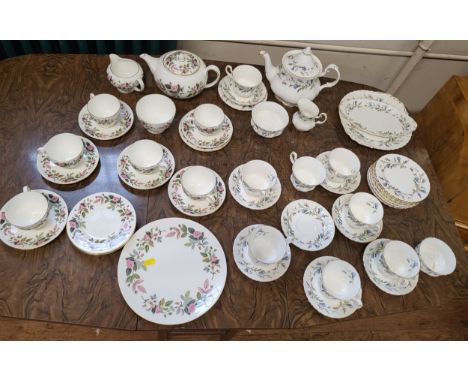 A Royal Albert Brigadoon tea service (30 pieces) and Wedgwood Hathaway Rose tea service (22 pieces). (52) 