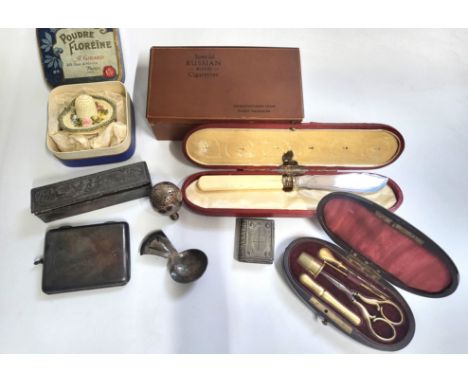 A cased etui set with gilt finish, in red lined box, together with a novelty white metal pepperette in the form of an owl, a 