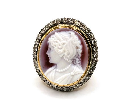 An 18ct yellow gold, diamond, and cameo cocktail ring, the cameo depicting a young woman in profile, within a border of round