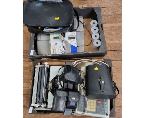 Boxes of typewriter, measuring equipment, fax, etc. 