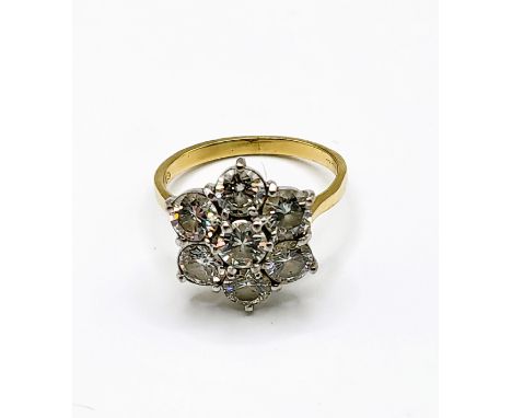 An 18ct yellow gold and diamond floral cluster ring, set with seven round brilliant-cut diamonds, of approximately 2.80 carat