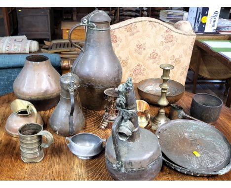 A collection of various brassware including pots, jugs, bowls, a candlestick, etc. 