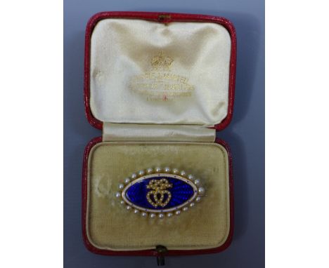 An early 19th Century yellow metal brooch with blue enamel and decorated with seed pearls (a/f)