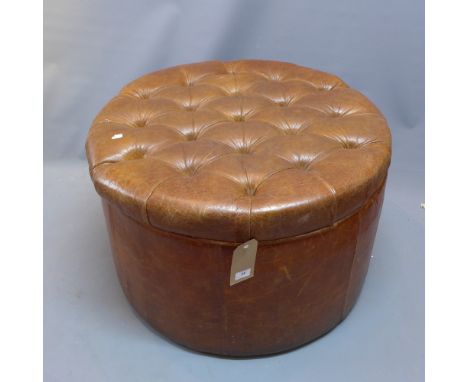 A large early 20th Century brown leather pouffe