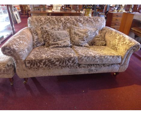 20th Century two seater sofa and matching pouffe on caster feet having velvet leaf design 