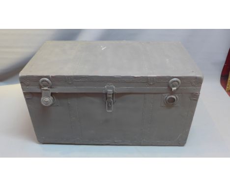 A grey painted steamer trunk. 
