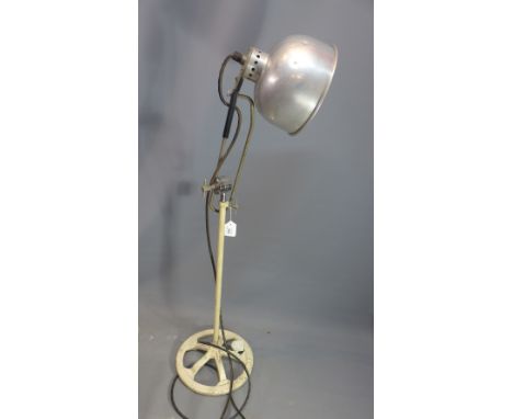 A 1930's duo ray spot light on cast iron base