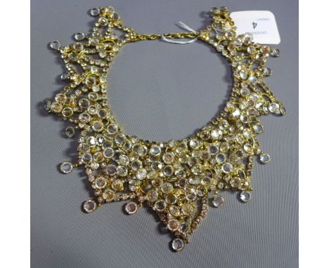 A vintage 1960s Kenneth Laine collar necklace encrusted with rhinestones and faux crystals on goldtone g. Signed K.J.L. to ba