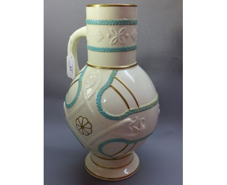 A Victorian ceramic flagon decorated in the Chinese taste painted with gold and turquoise highlights on a white ground. H-34c
