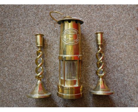 Miners lamp and pair of brass candlesticks