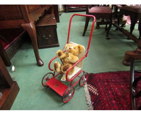 A 1950's child's Tri-ang push chair with Steiff Teddy bear