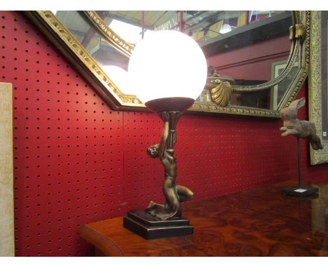 An Art Deco style lamp, female figure holding aloft a globe, 38cm tall