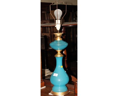 A Victorian design blue glass and gilt metal table lamp modelled as an oil lamp and a collection of assorted coloured drinkin