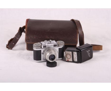 A Braun "Paxette" 35mm range finder camera, in case, with a "Sixtus" light meter