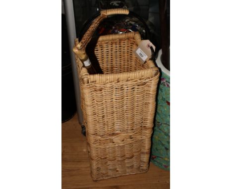 A square wicker stick stand, a riding crop and a fly whisk