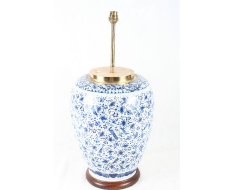 A Delft ware jar now converted as a lamp base with all-over scroll and animal design, 23" high (restored base)
