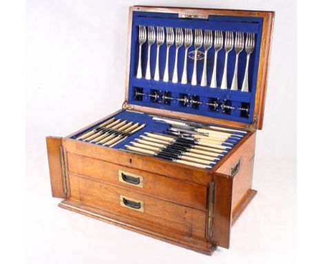 A canteen of Old English table plate including soup ladle, sauce ladles, basting spoon, etc, and ivory handled knives, in bra