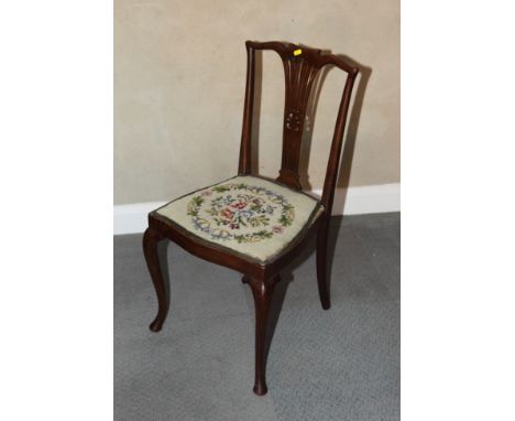 A pair of early 20th Century wooden occasional chairs with fretted splats and tapestry seats and a rectangular tapestry cover