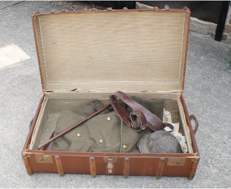 A Royal Engineers major's great coat from Burberry's, a tin hat, a Sam Browne belt, a swagger stick and a pair of Barr & Stro