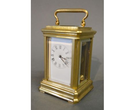 A French Brass Cased Miniature Carriage Clock, the enamel dial with Roman numerals and with lever escapement, 7.5 cms tall 