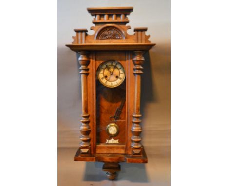 A Mahogany Vienna Type Wall Clock, the enamel dial with Roman numerals and two train movement 