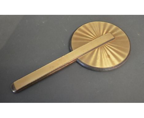 A Birmingham Silver and Gold Enamel Backed Hand Mirror, 26 cms long 