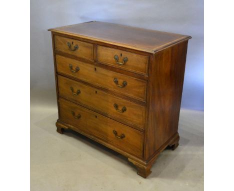 A 19th century mahogany satinwood inlaid chest, the crossbanded moulded top above two short and three long drawers with brass