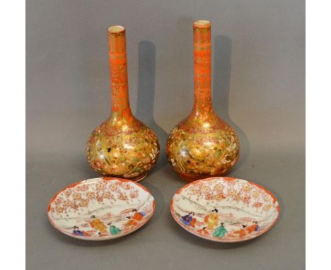 A Pair of Kutani Bottleneck Vases together with a pair of similar saucers 