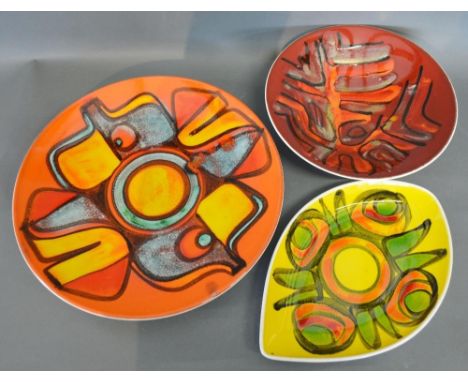A Poole Pottery Aegean Circular Charger, 34.5 cms diameter, together with another similar dish, 27cms diameter and another Po