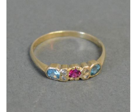 A 9ct. Gold Ruby, Blue Topaz and Diamond Ring 