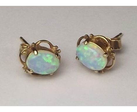 EARRINGS.
A pair of synthetic opal stud earrings.