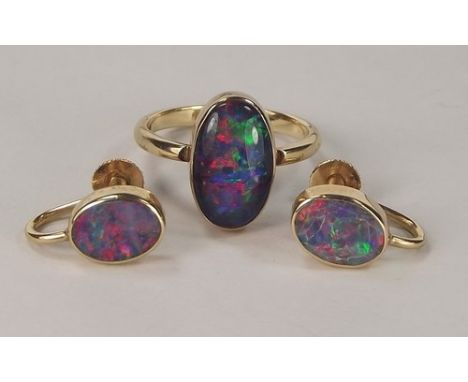 OPAL RING ETC.
A 9ct. gold mounted opal doublet ring & a pair of matching earrings with screw fittings.