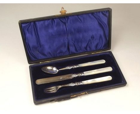 CHRISTENING SET.
A child's Edwardian silver mounted, mother of pearl Christening set, cased.