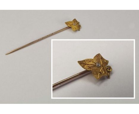 STICK PIN.
An 18ct. gold diamond set stick pin.