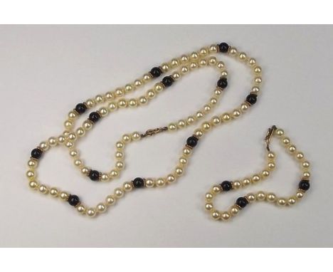 PEARL SET.
A 9ct. gold mounted & black onyx bead necklace, length 58cm & a similar gold mounted bracelet.
