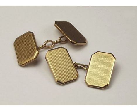 CUFFLINKS.
A pair of 9ct. gold engine turned cufflinks. 14g.